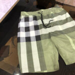 Shorts estivi checkered verde casuali uomo donna con elastico e tasche comode.