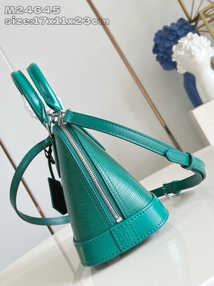 Borsa triangolare in turchese, manici e tracolla regolabile, elegante e moderna per ogni occasione.