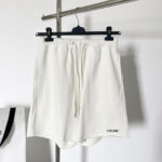 Shorts bianchi Celine donna in cotone, stile minimalista e versatile.