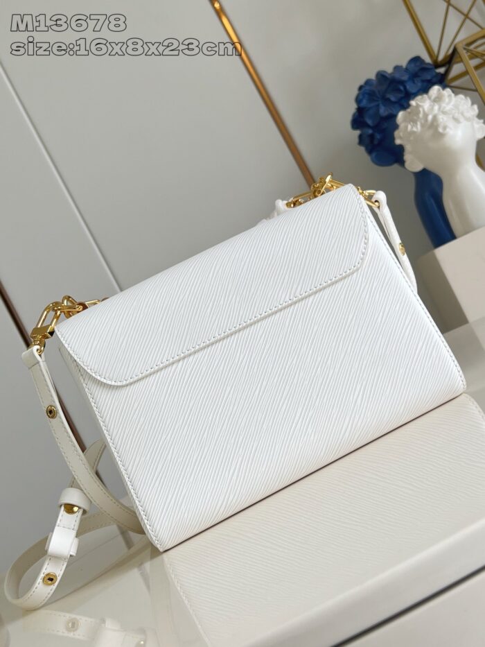 Borsa bianca elegante con dettagli oro, design moderno e versatile per ogni occasione.