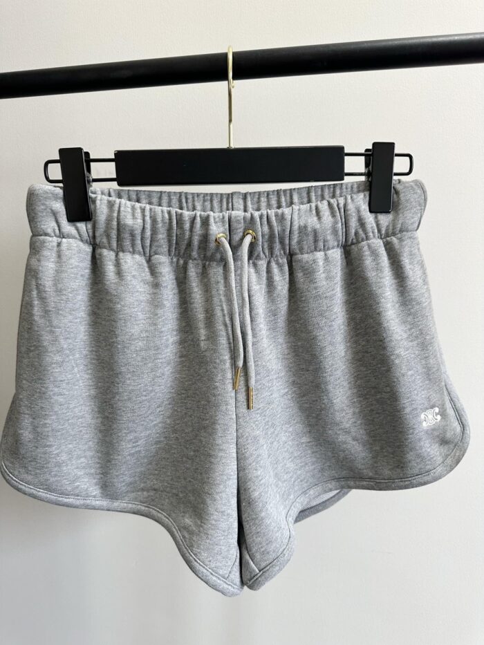 Pantaloncini sportivi grigi in cotone con elastico e cordino, ideali per fitness e relax.